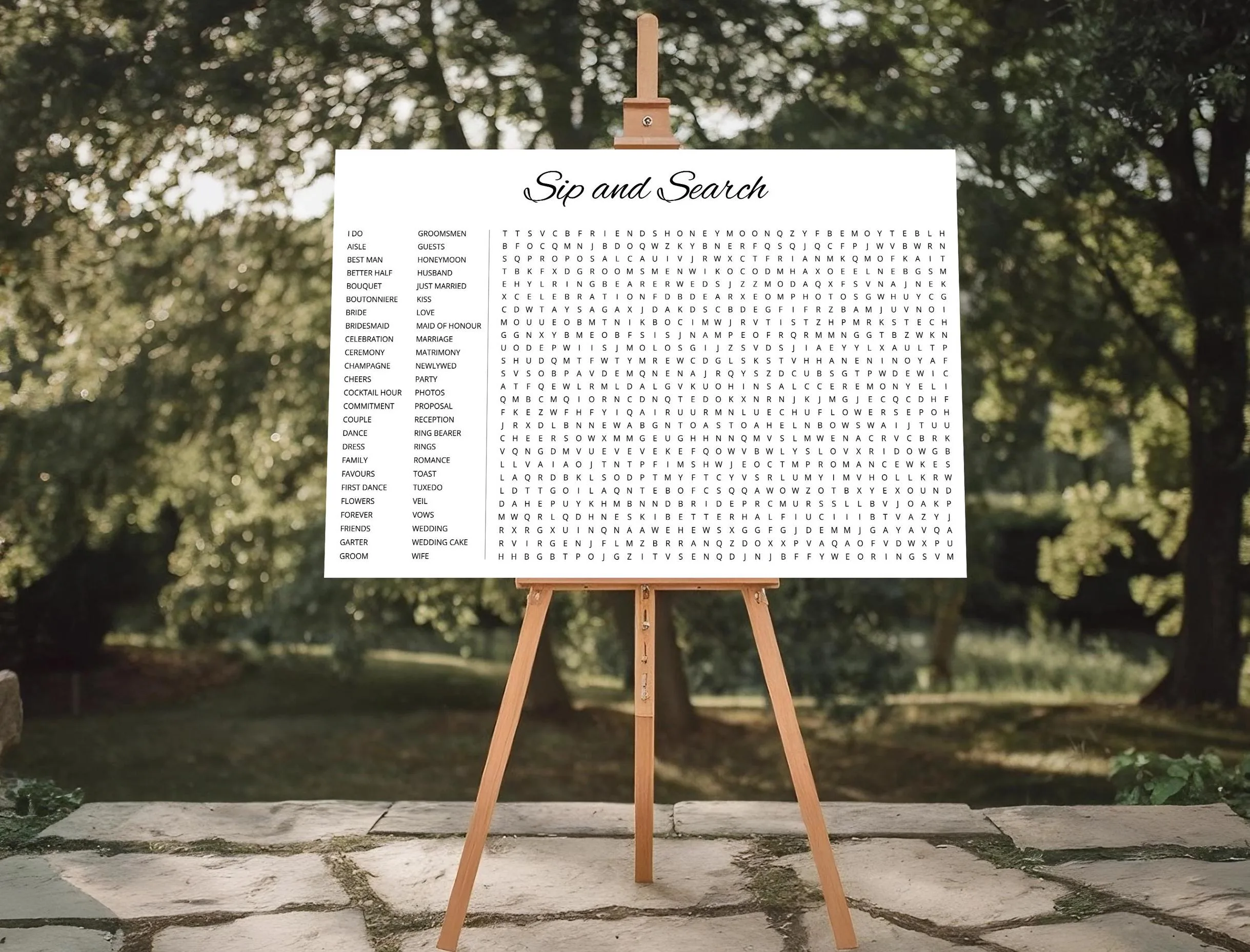 Custom Sip and Search wedding word search on wooden easel at outdoor garden – personalized engagement party activity